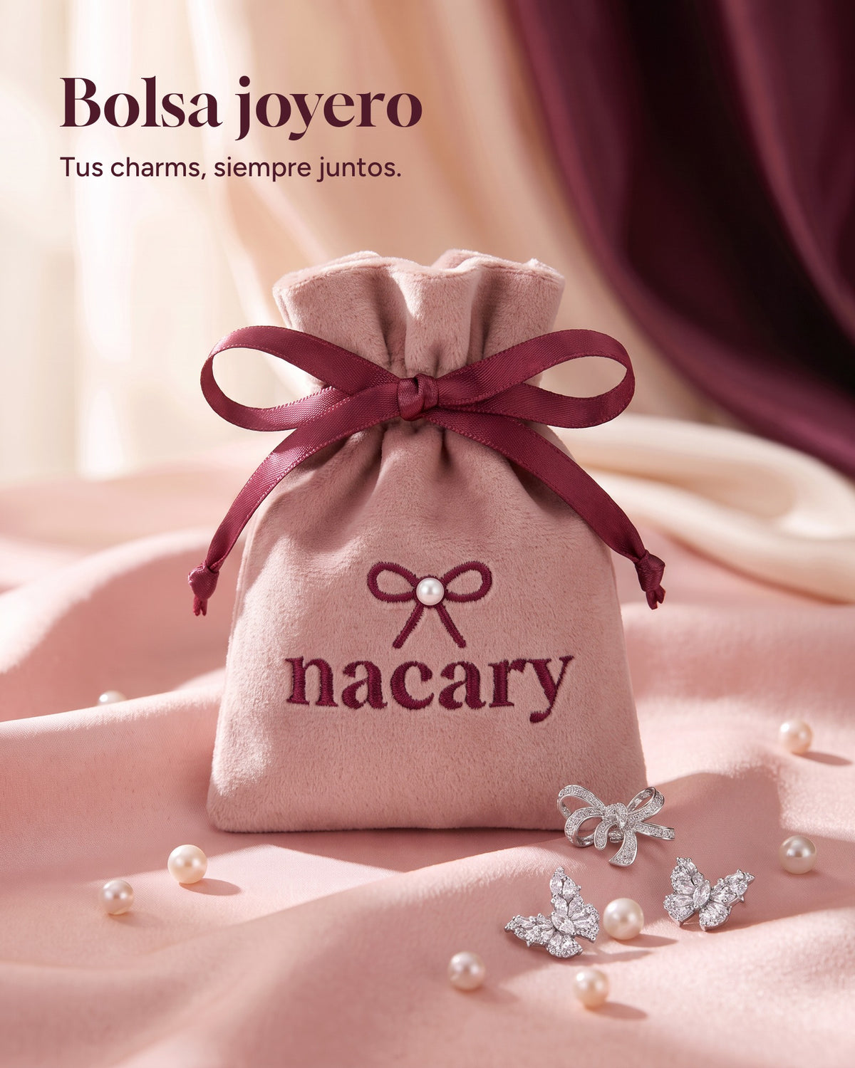 Blush-pink velvet jewelry pouch embroidered with the Nacary logo