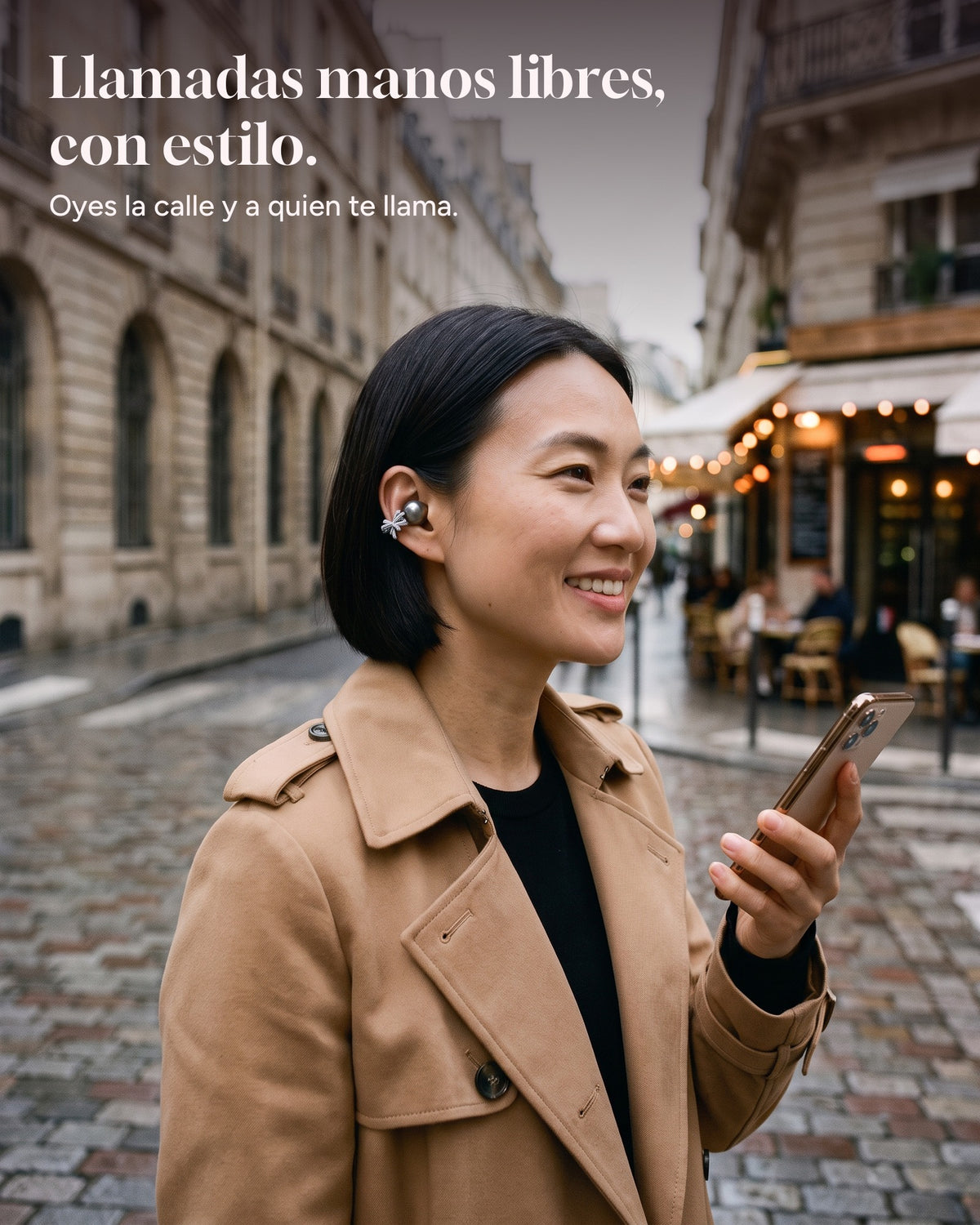 Woman taking a hands-free call on the street with Nacary earbuds in Onyx