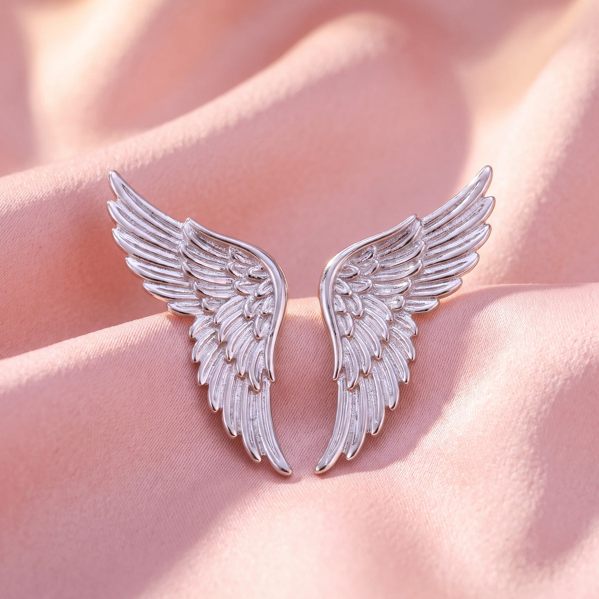 Angel Wings charm pair, close-up