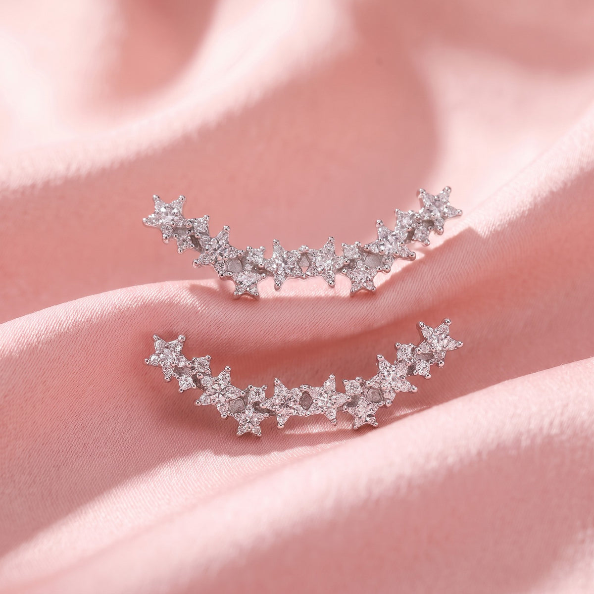 Constellation charm pair, close-up