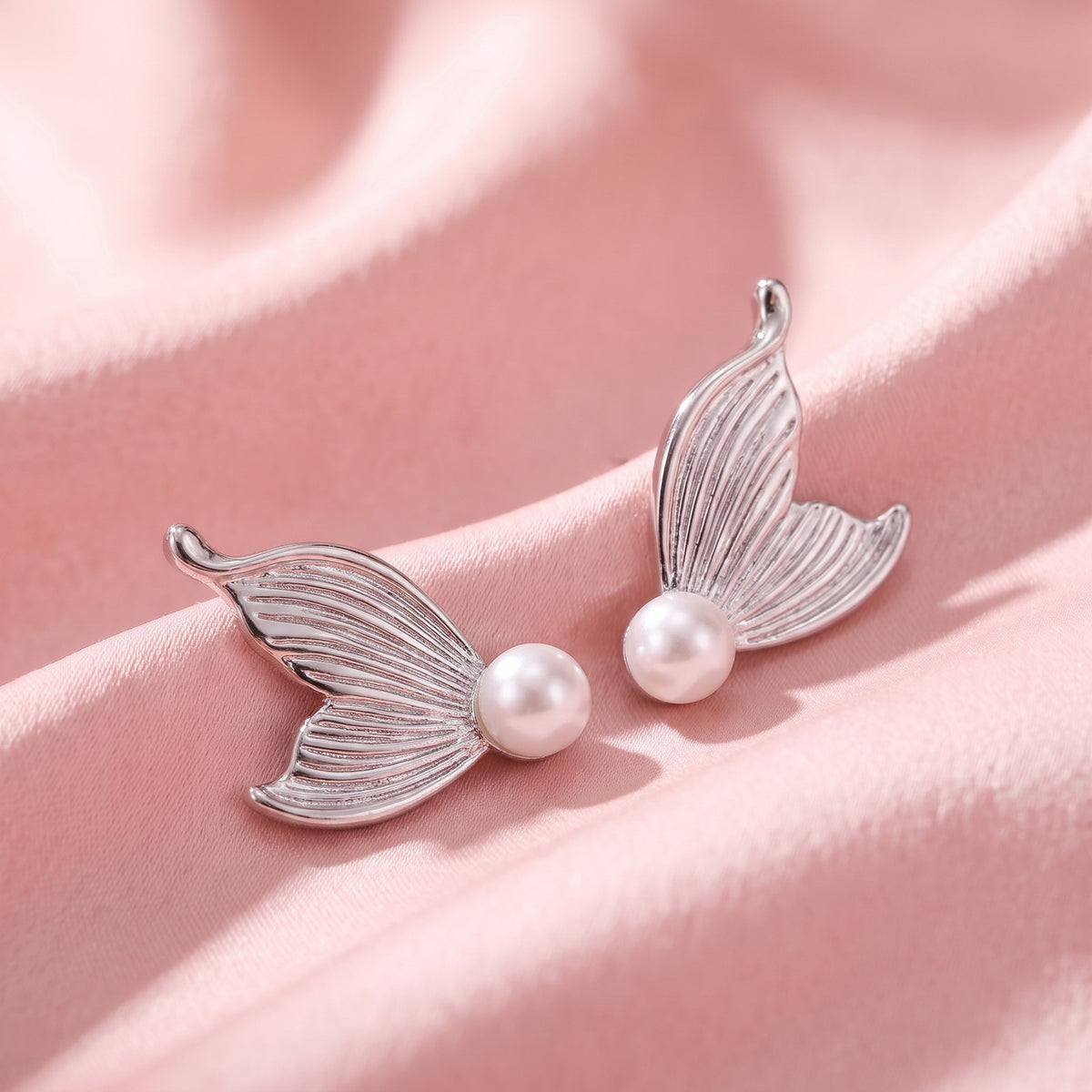 Mermaid charm pair, close-up